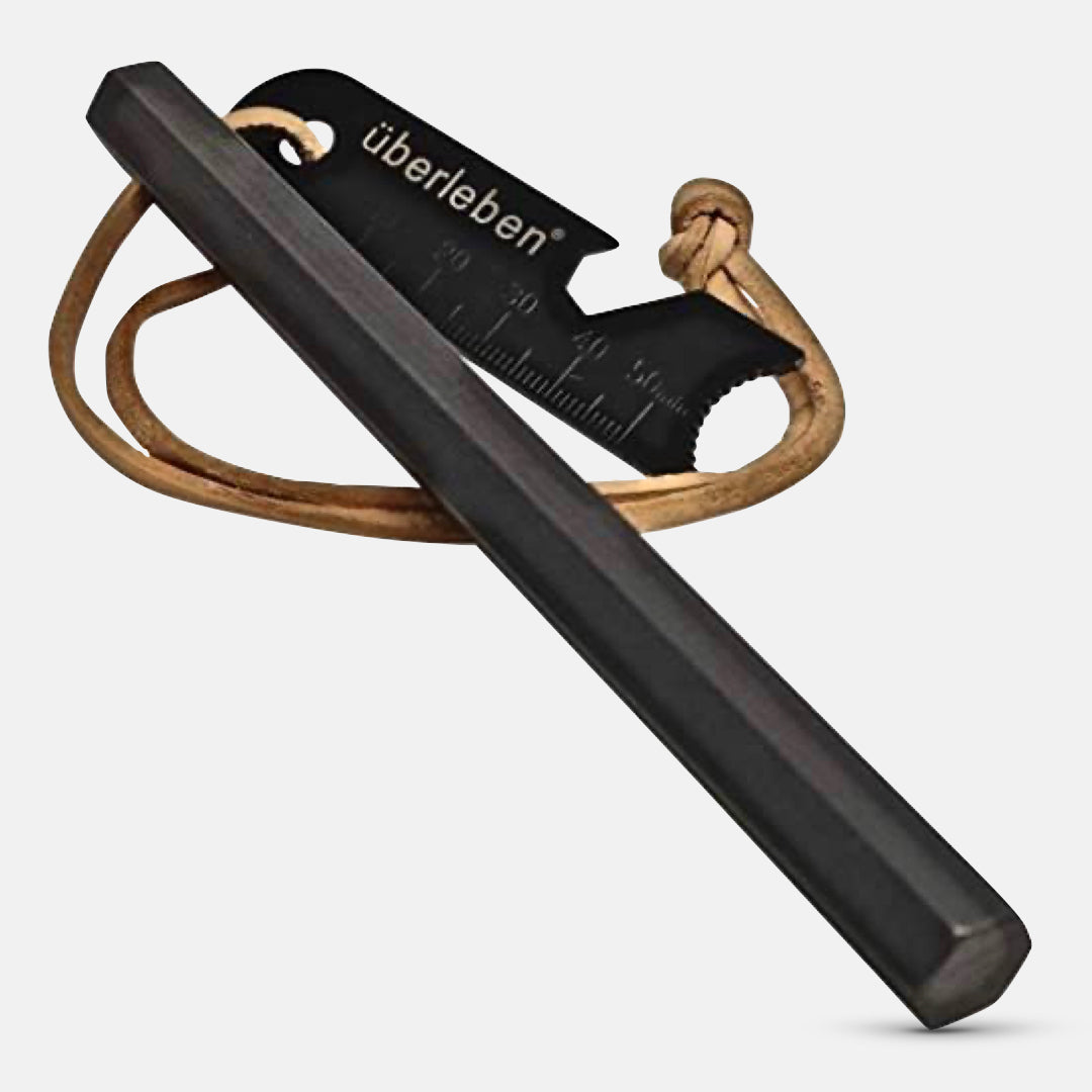 The Hexå | Fire Starter from Überleben includes a ferro rod with a metal striker attached to a leather cord. This fire starter is ideal for bushcraft survival situations.