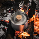 Lightweight Überleben Titanium Kessel Pot over a campfire.